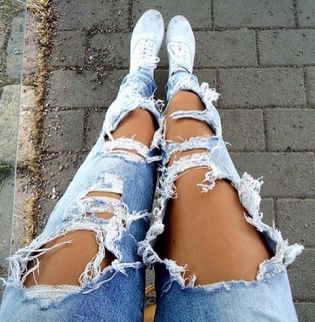 tan legs and ripped jeans